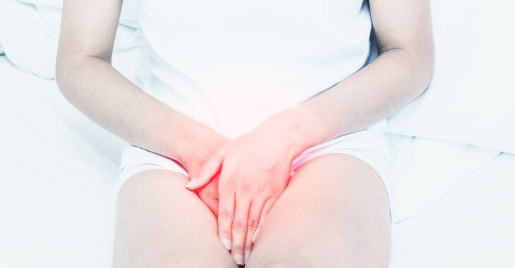 Woman suffering from pain cause by UTI or STD.